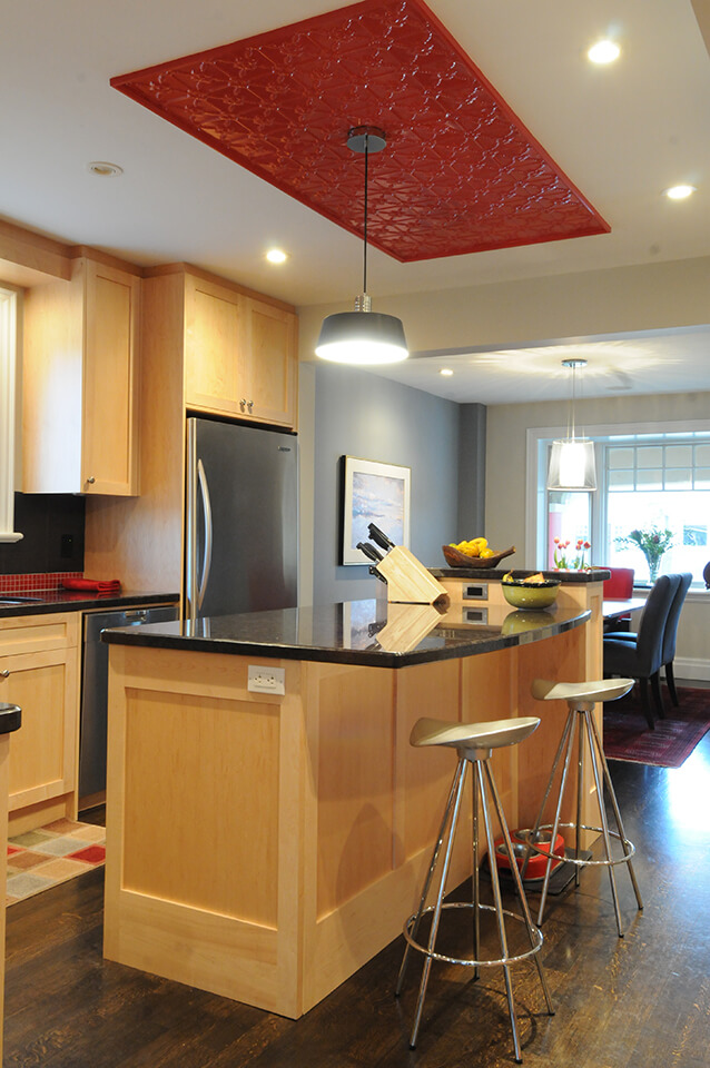 Red tin ceiling above kitchen island